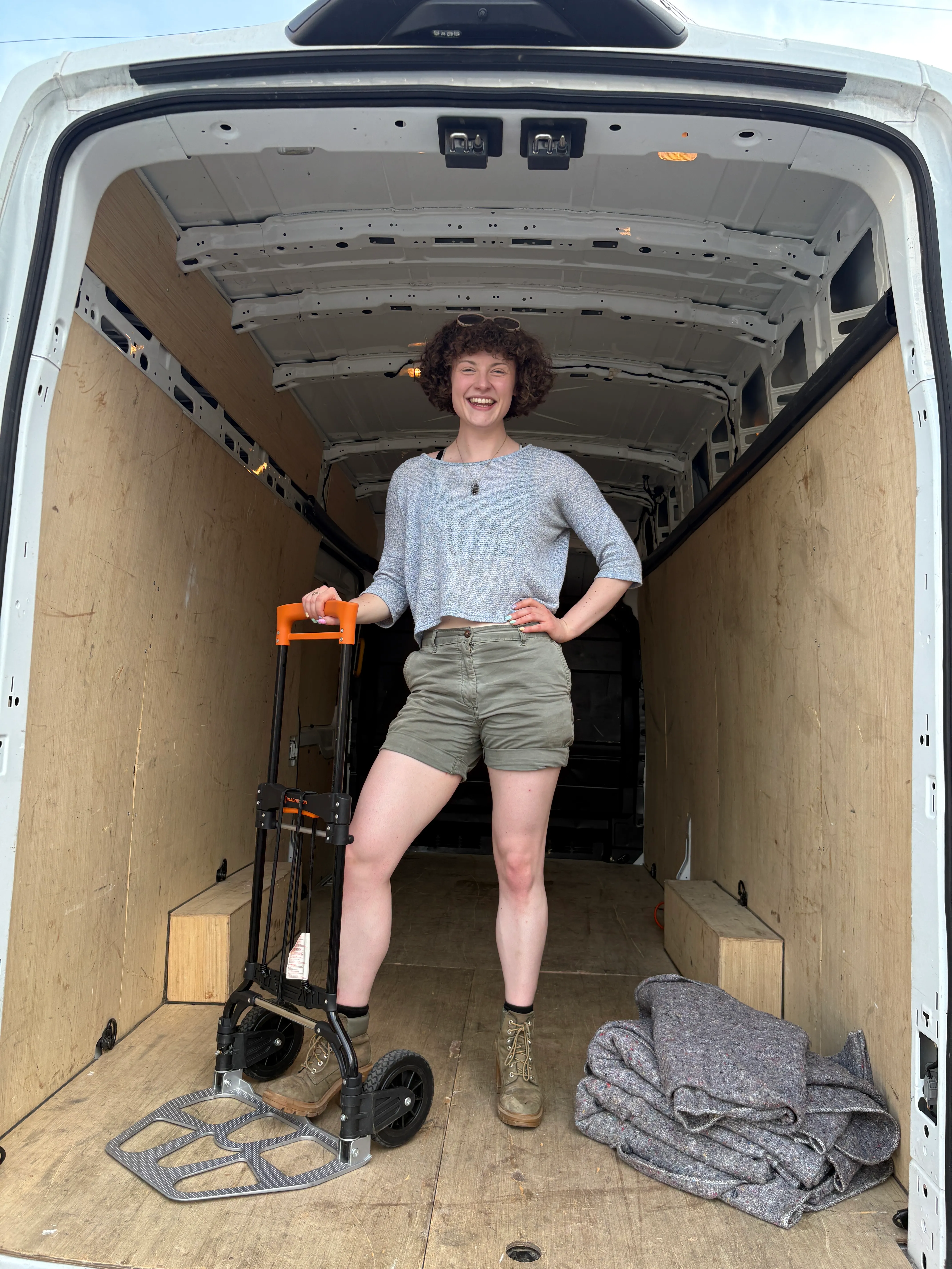 Hannah, founder of Han With A Van female removals service, with her moving van in London.