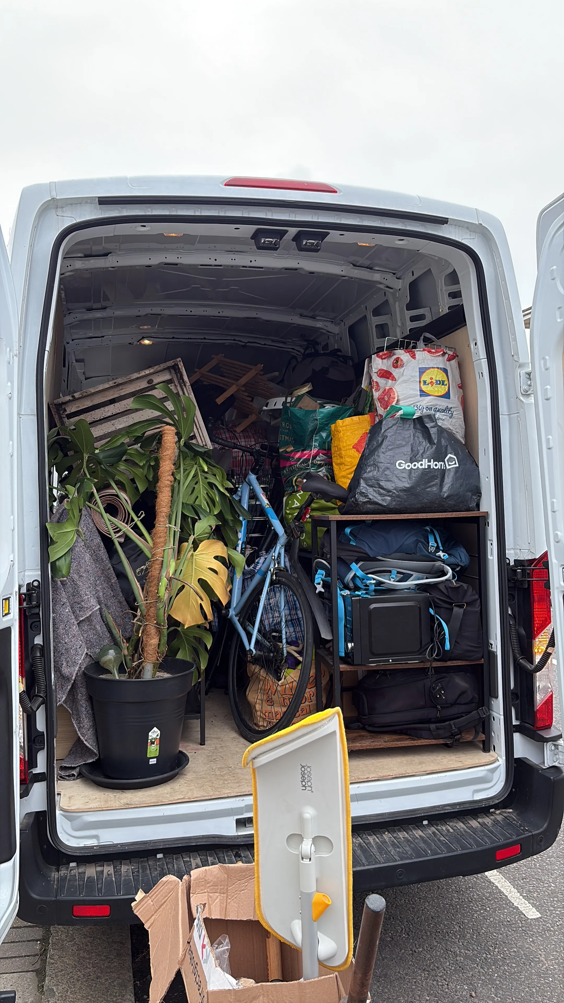 A Han With A Van moving van loaded neatly with boxes, blankets and straps for a London house move.